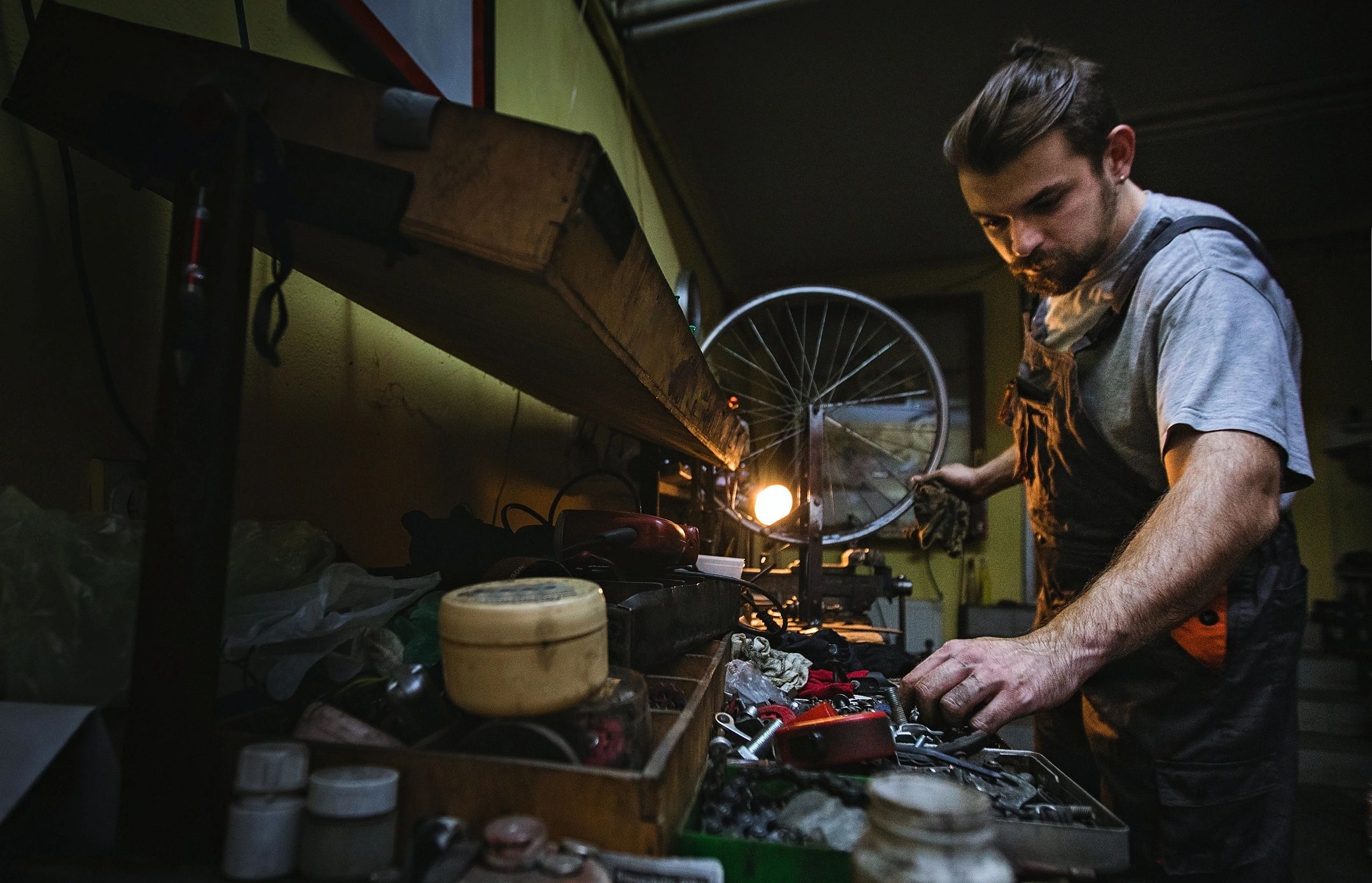 Technician preparing parts for motorcycle maintenance